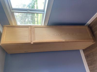 Two unfinished pantry cabinets