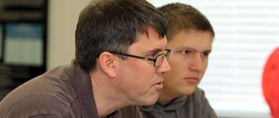 Professor of Physics, James Brown, with student.