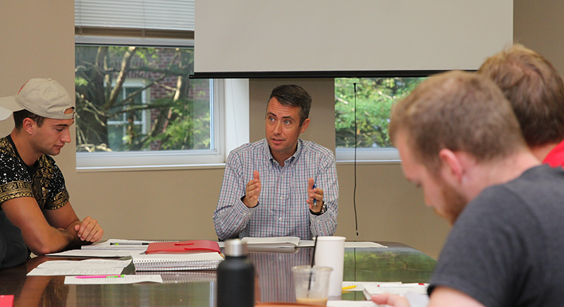Dr. Brian Tucker teaching in his German language class.