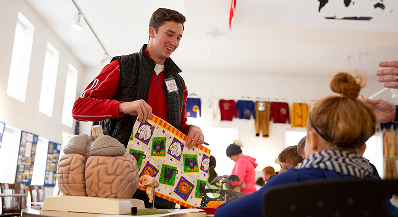 Students frequently assist in teaching at community events such as Brain Day.