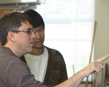 Professor of Physics James Brown with a student