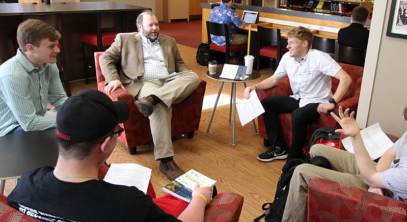 Religion Professor Derek Nelson and students enjoy coffee and class at 1832 Brew.