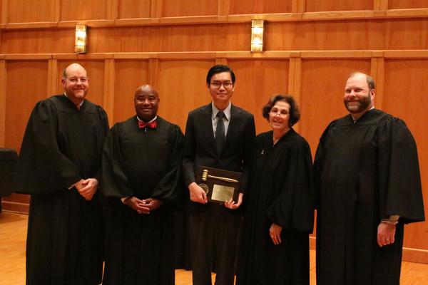 Top Advocate The Anh Pham ’18 and the judges panel.