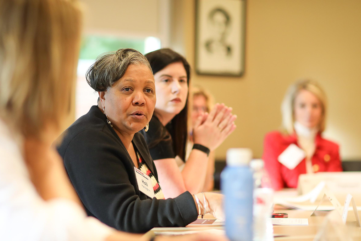 a group of women sitting at a table