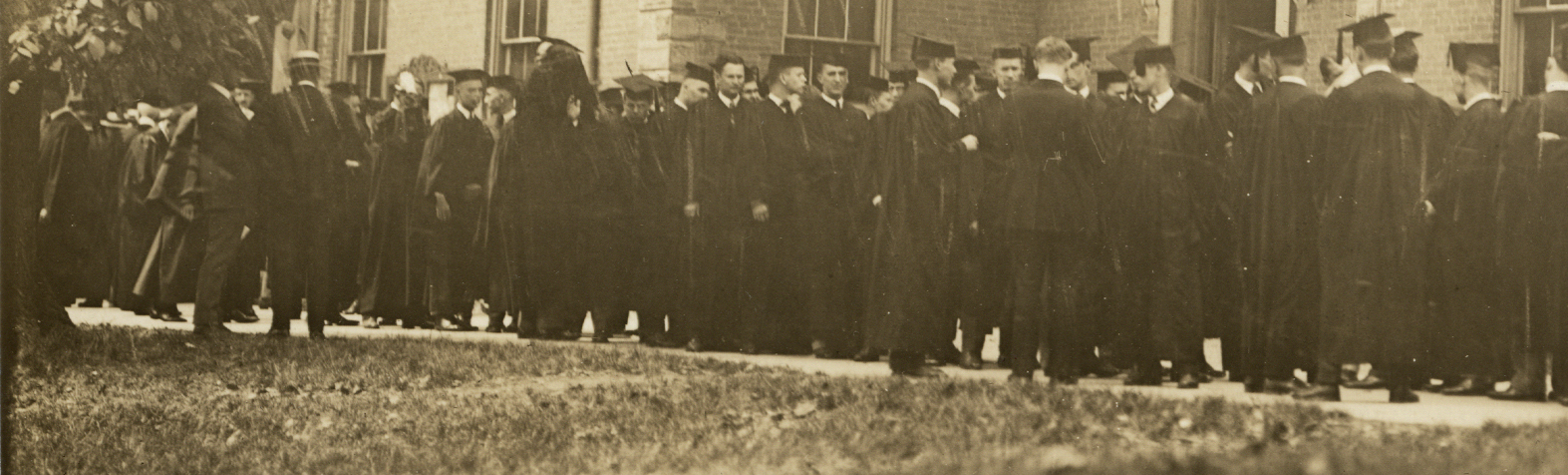 The Class of 1923 lines up for procession in front of Center Hall. That tradition continues today.