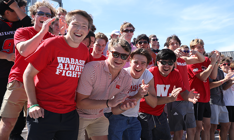 a group of people in red shirts