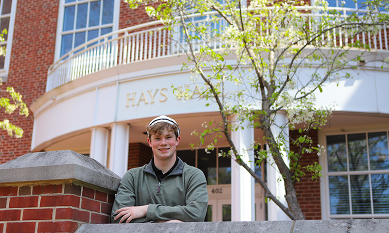 Aidan Mason &rsquo;26 in front of Hays Hall