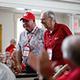 Two alumni approach the stage to sing "Old Wabash."