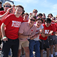 a group of people in red shirts