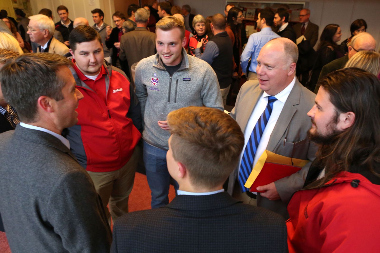 Chair of the Humanities Division and Professor of Spanish Dan Rogers and students savor the moment with Professor Tucker.