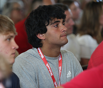 A student listens closely at Ringing in.