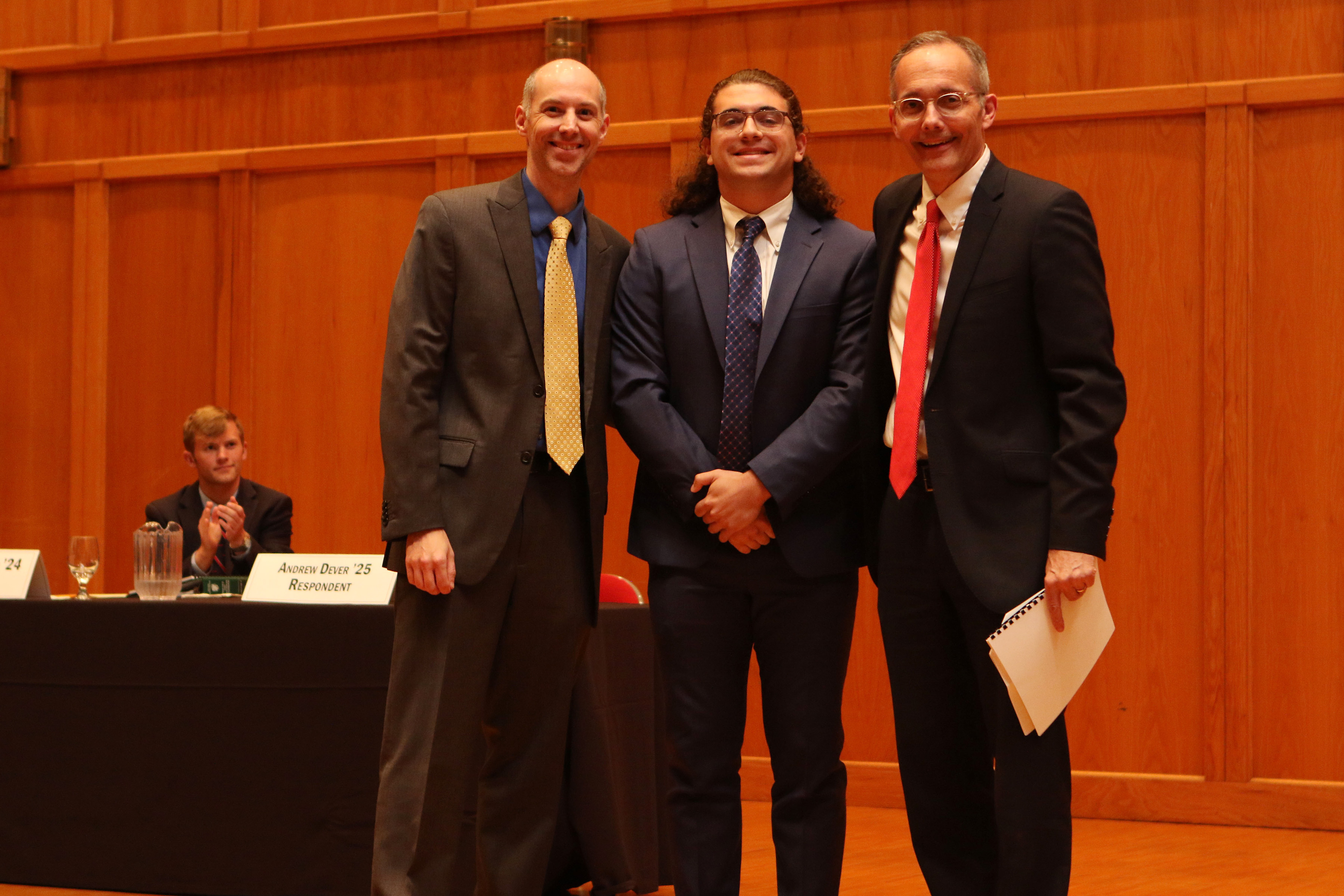 Andrew Dever ’25 (center) was named the recipient of the Floyd Artful Advocacy Prize.