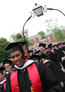 Graduates proceed through the Senior Arch.