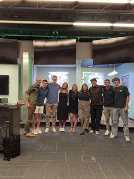 Taylor '25 (second from right) stands with the REVelry team during their "Social Selling" event to build personal branding skills.