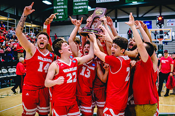 Vinny Buccilla's (front right, #2) timely three-pointer evetually set off a celebration.