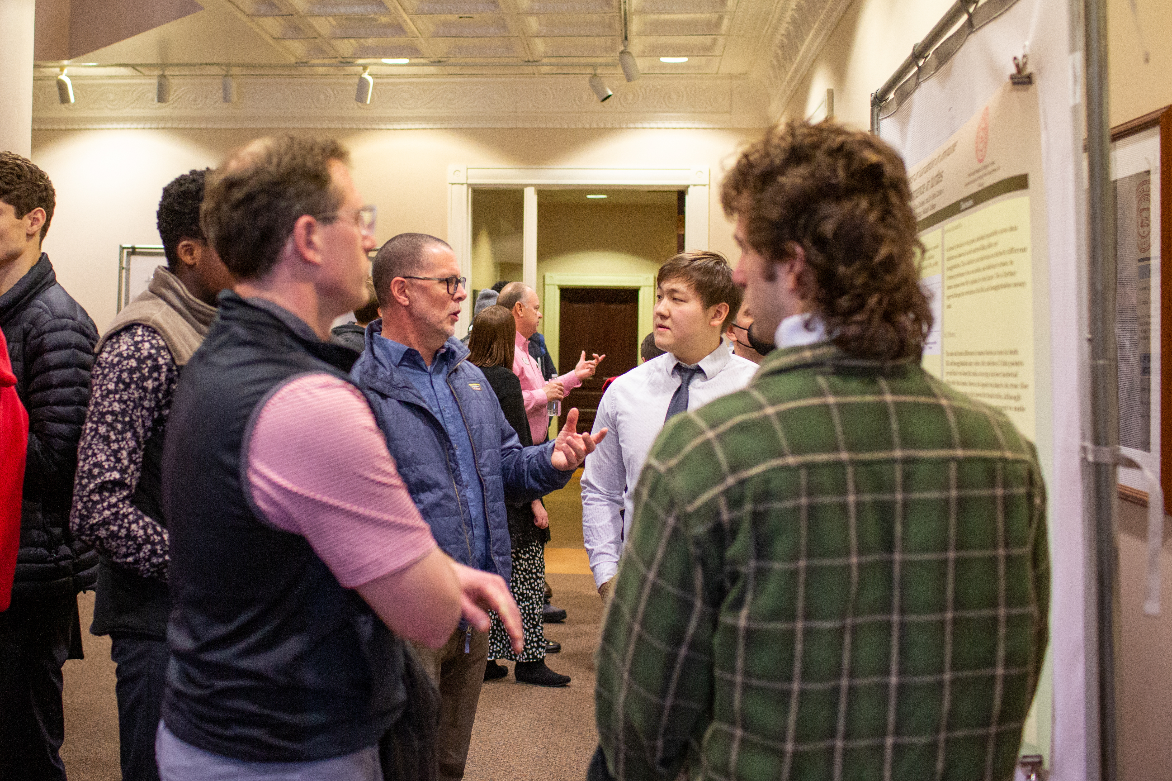 A buzz of activity surrounded poster presentations in Detchon Center's International Hall.