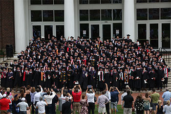 Wabash graduates sing "Old Wabash" on the steps of the Allen Center.