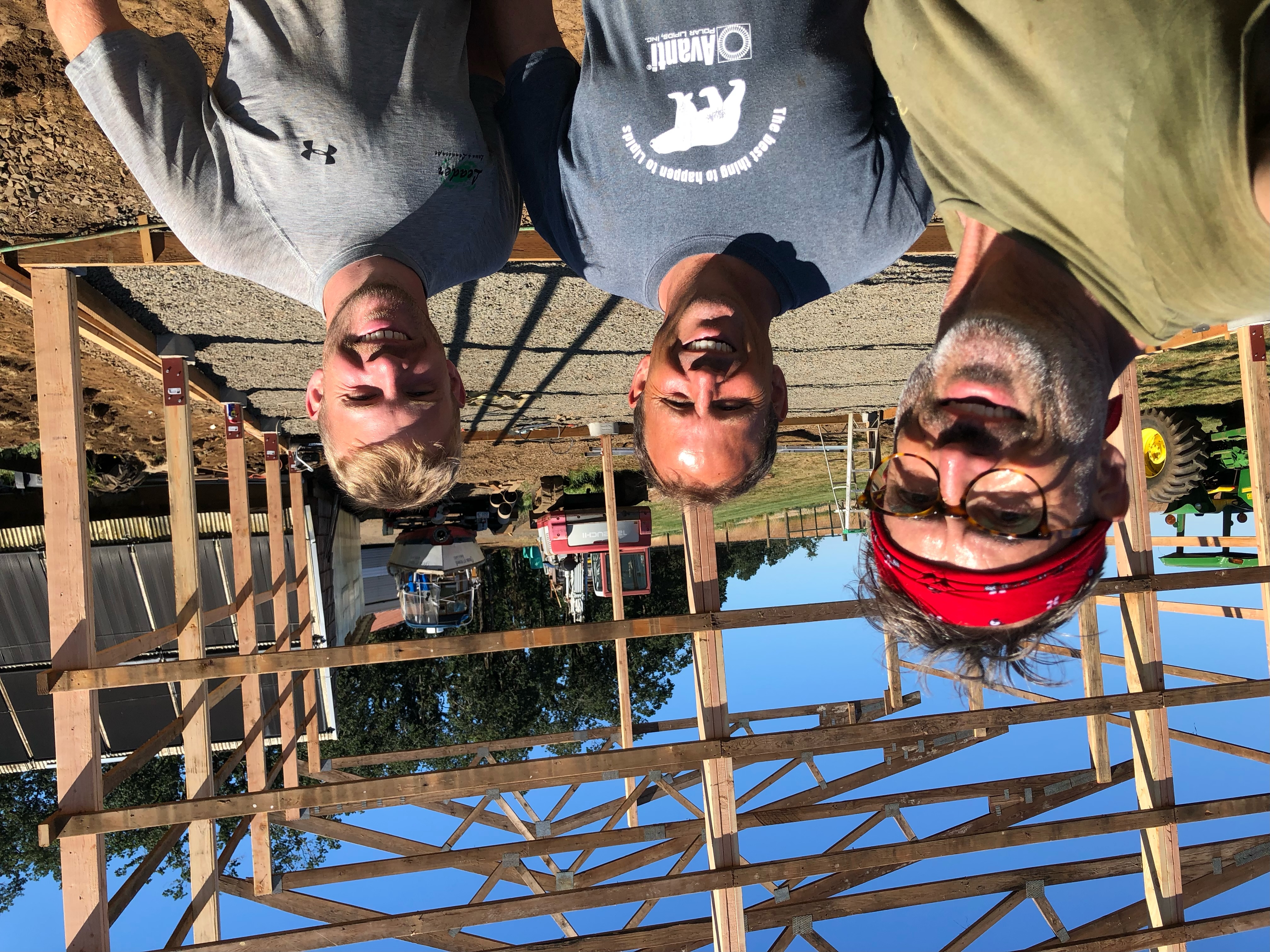 Family friend Dean Smoll, Wabash President Scott Feller, and his son, Jake, as they begin building a barn in Oregon last summer.
