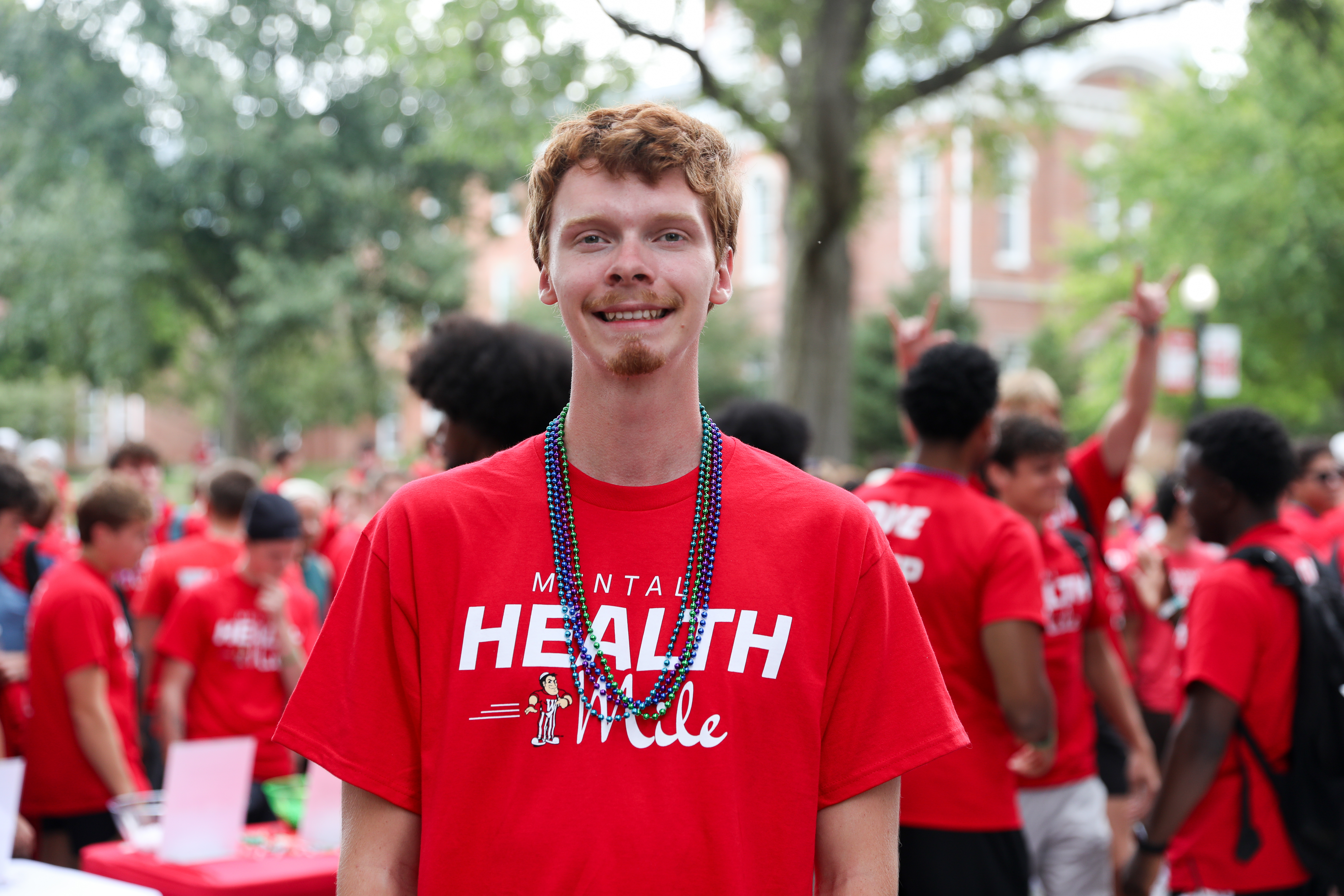 Sawyer Lewis &rsquo;28 distributed beads at the 2026 Mental Health Mile. Each color corresponded with a connection to the cause.