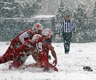 Little Giants pounce on the Brit loose ball.