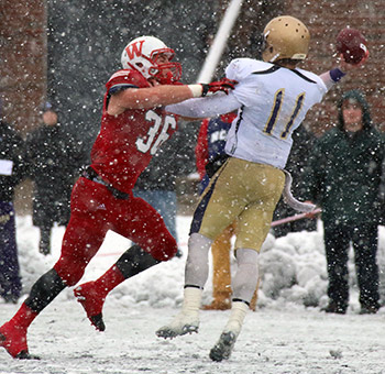 Evan Hansen hassles Brit QB Bona into an interception.