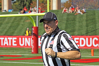 Woods '93 officiating the Mid-American Conference