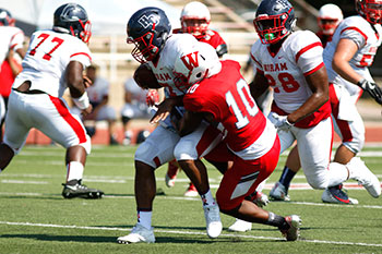 Byshup Rhodes '19 makes a big tackle against Hiram.