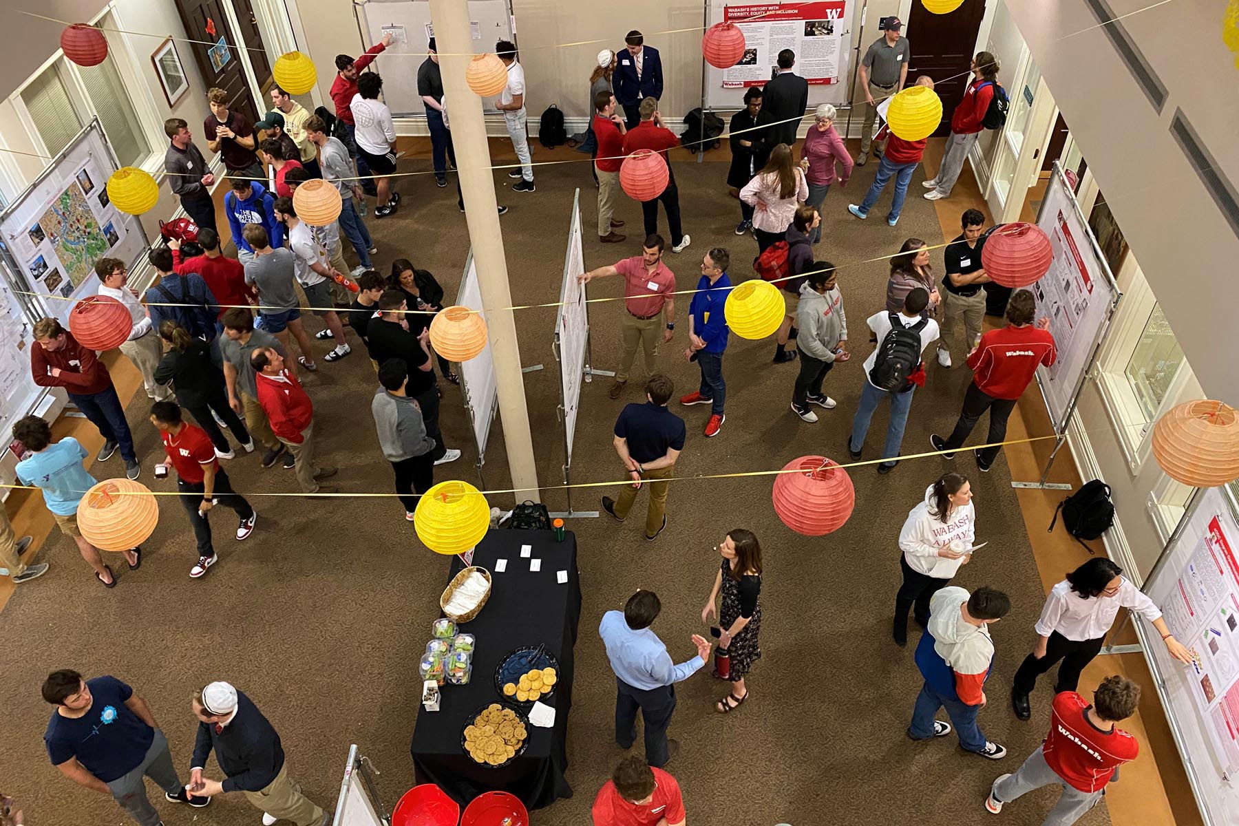 A buzz of activity surrounded poster presentations in Detchon Center's International Hall.