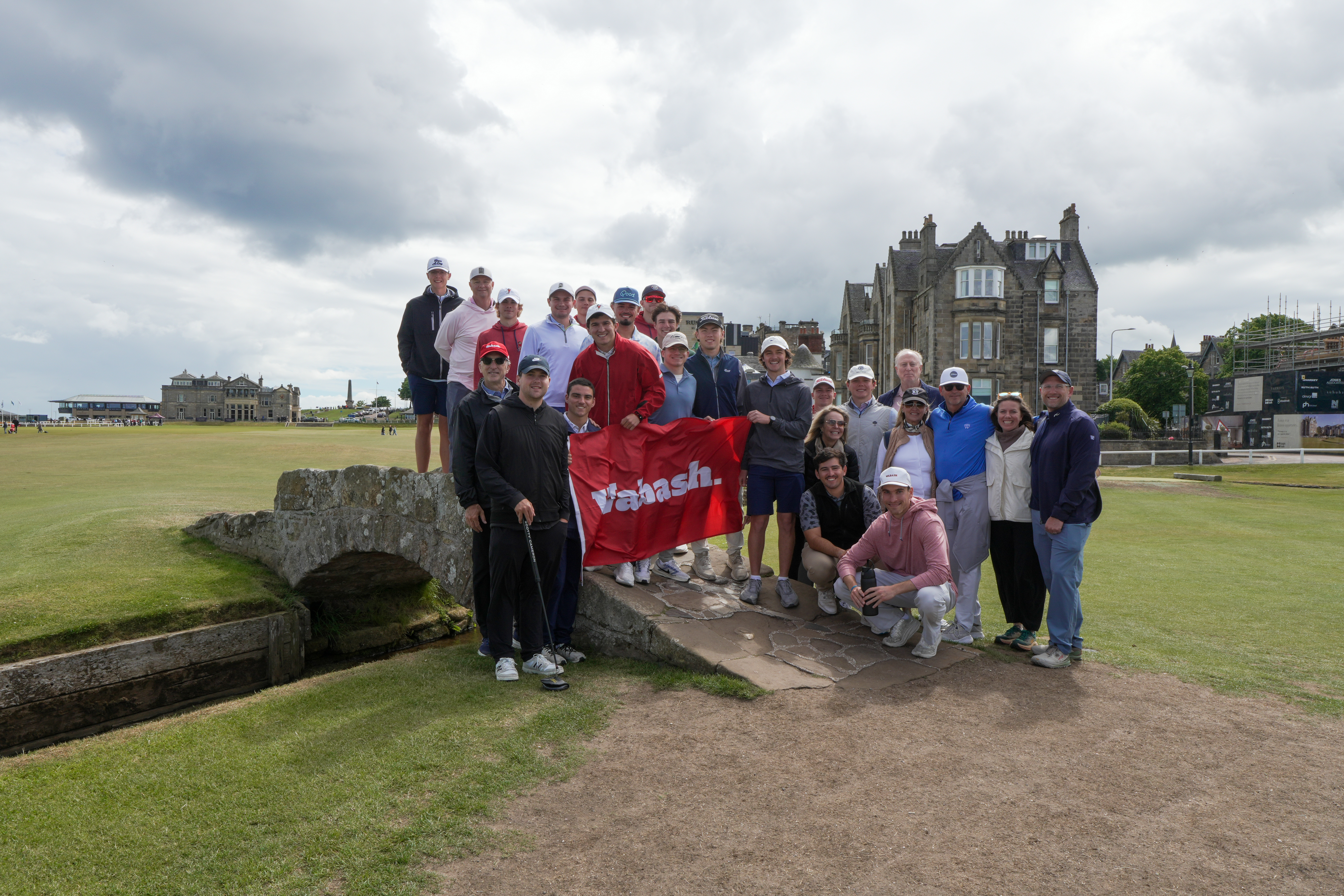 The group atop the iconic Swilcan Bridge on the 18th hole of the Old Course.