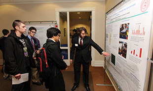 Flock (right) points to some of the details of his findings.