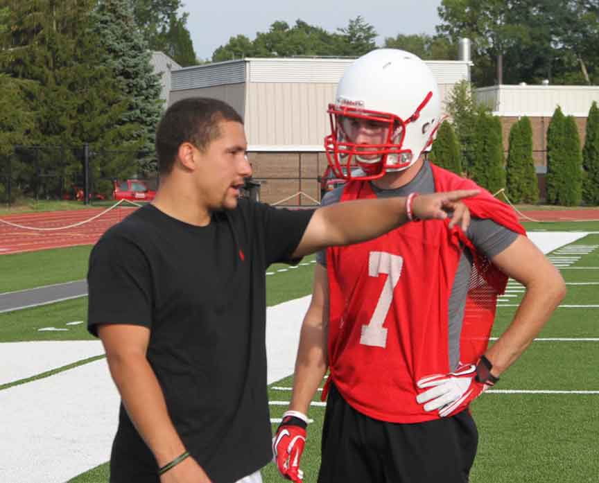 Senior Austin Hodges works with a new Wabash player during one of the freshmen practices.