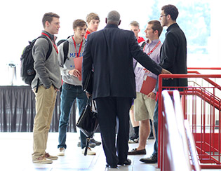 Honor Scholarship Weekend attendees listen intently to Henry Hunt '85.