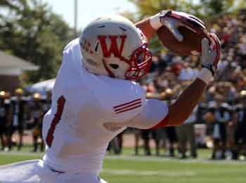 Houston Hodges caught this 14-yard touchdown pass from Andy Walsh in the Little Giants' 65-0 blowout win at Allegheny.