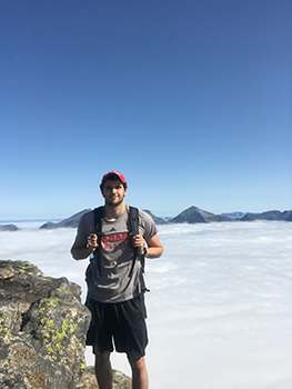 Jones at the top of Romsdalseggen Ridge in Åndalsnes, Norway