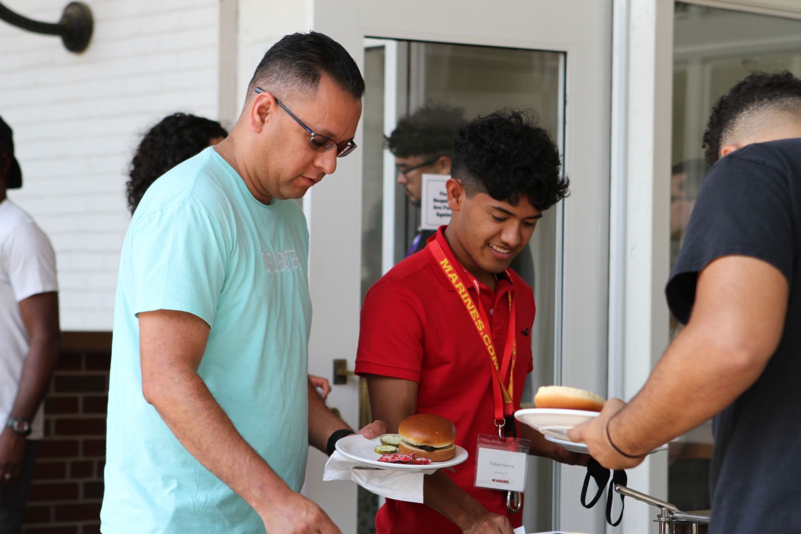 WLAIP students, families, mentors and staff members gather for lunch at the Sparks Center.