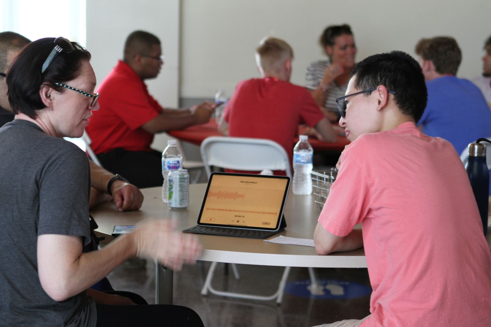 Maeda (right) interviews a Wabash College parent during a recent assignment for the Journal Review.   