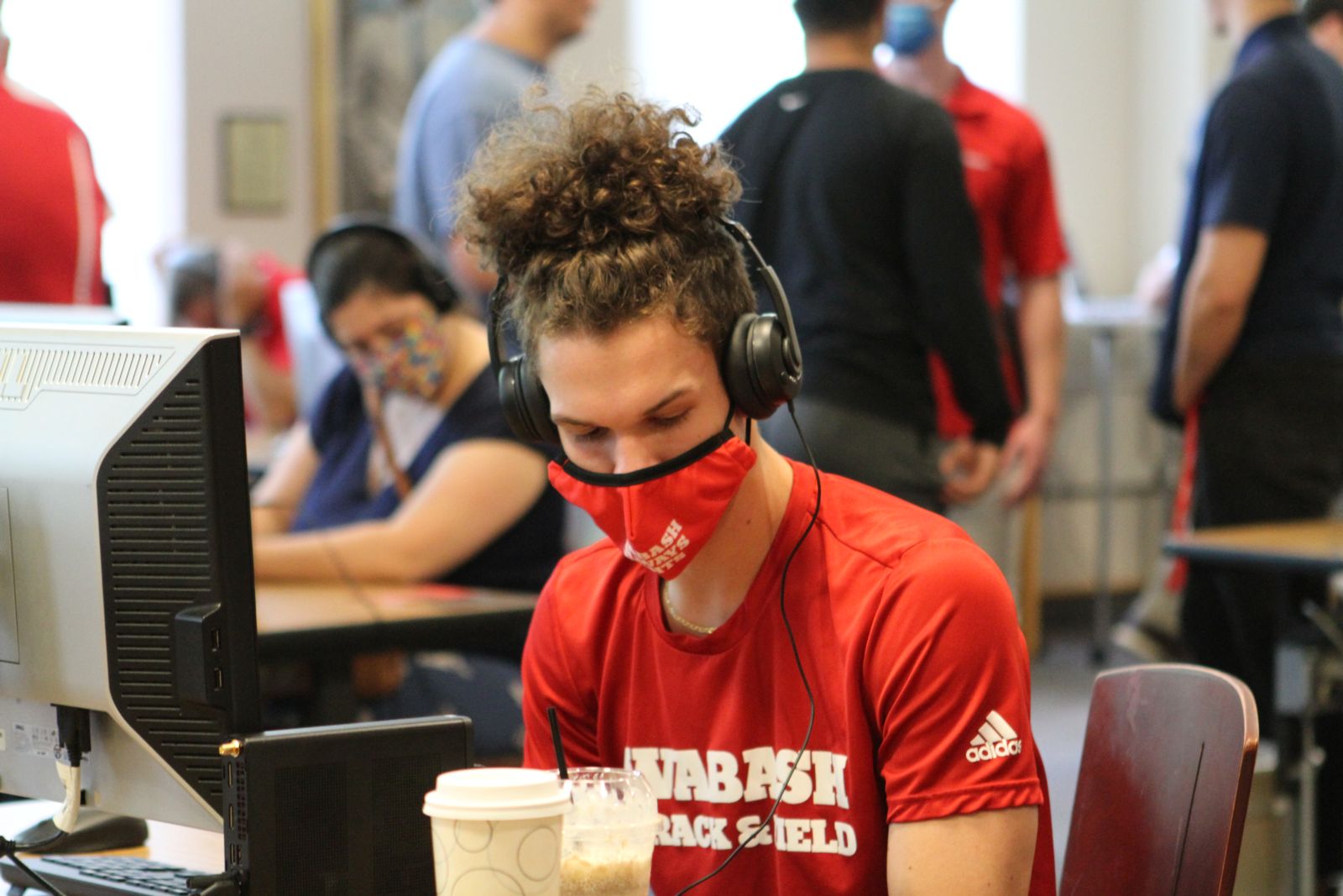 WLAIP mentor Willy Shepler '23 listens to an essay.