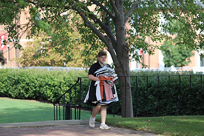 Students carted and carried armloads of their belongings to their dormitories.