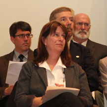 Kay Widdows listens as Dean Phillips reads her citation