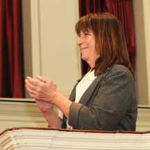 Kay Widdows applauds her colleagues after she received the Excellence in Teaching Award