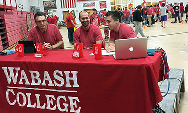 Andrews, center, during the live noon broadcast on Day of Giving.