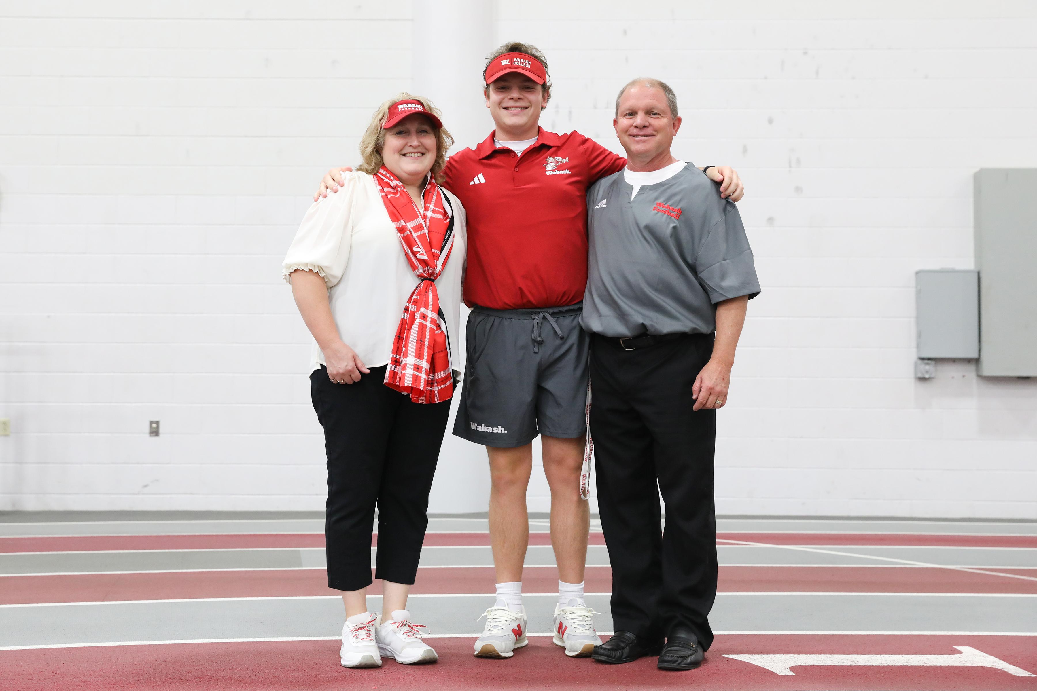 Alex Kindig ’26 with his parents on Senior Day