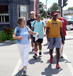 Crawfordsville resident Helen Hudson (left) leads a tour of the city during freshman orientation.