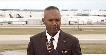 Houston Mills ’85, Vice President of Flight Operations for UPS, speaks to the press after piloting the first shipment of the Pfizer COVID-19 vaccine to Louisville. 