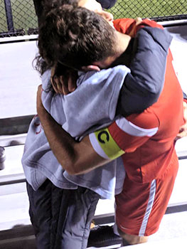 Dorsuleski hugs his mom after the win against DePauw