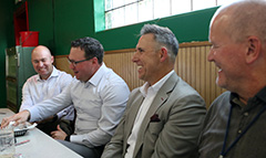 (from left) Craig Demaree, J.P. Patterson, Steve Woods, and Tim Maguire share a laugh during their lunchtime conversation. 