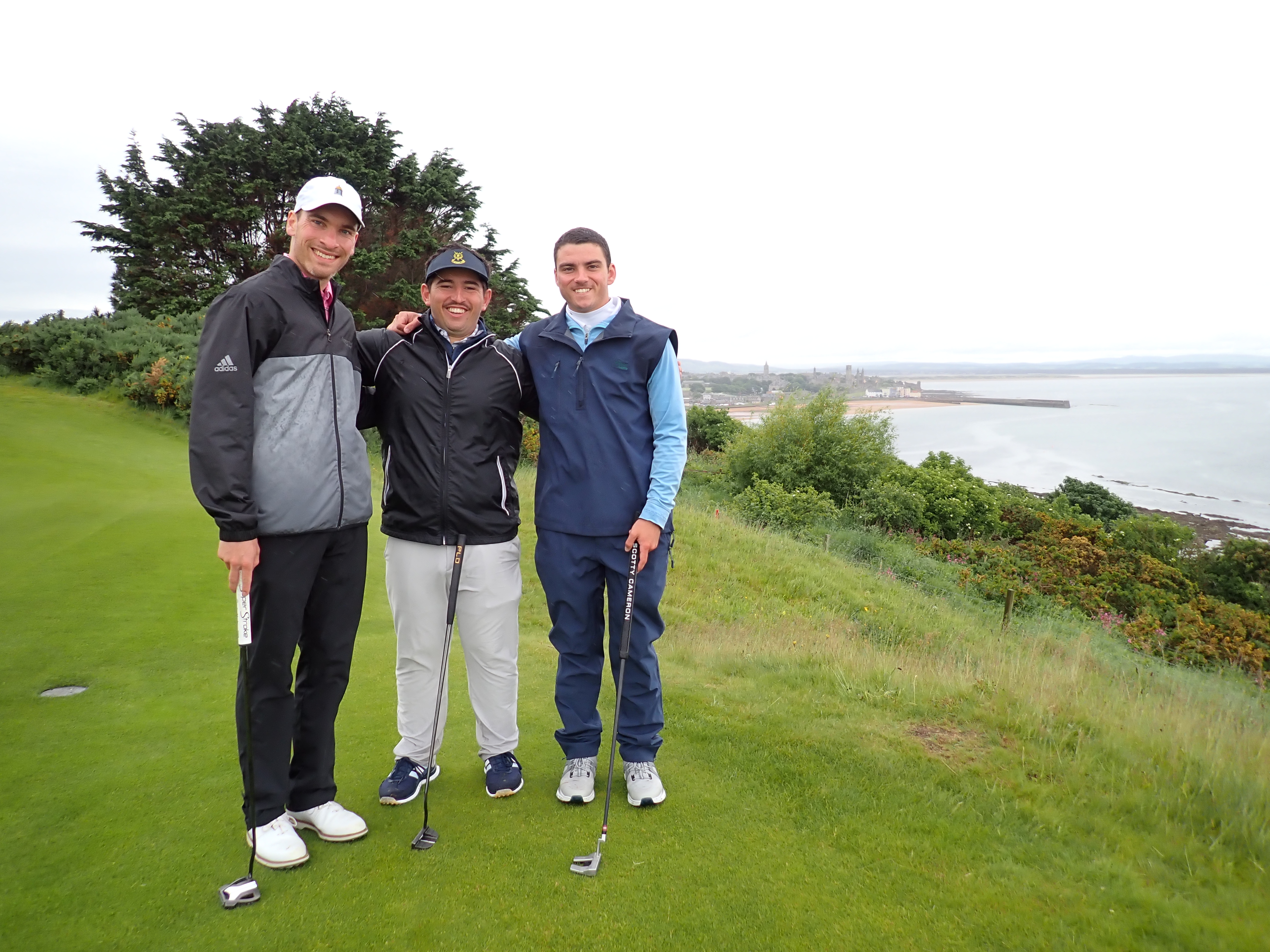 Coen Bauschek &rsquo;28, Antonio Grandinetti &rsquo;28, and Alex Schenkel &rsquo;28 take in the view of the North Sea from the fairway.