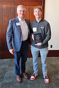 Pickett (right), pictured with Dean of Students Greg Redding, is one of 29 first-generation college students statewide to be honored. 