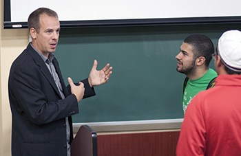 Nick Prihoda '99 chats with students following his presentation Monday. 