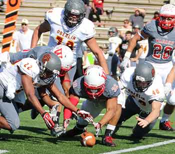 Everyone scrambles trying to recover a fumbled punt